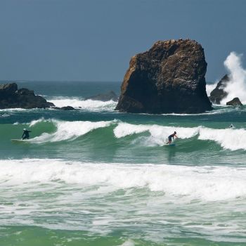 Surfers surfing waves in Rockaway Beach Pacifica, California 